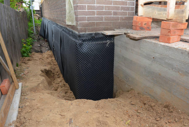 Happy homeowners after waterproofing job in Goodland